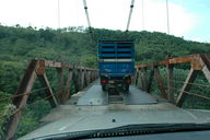 It's always fun to go over a rickety one-lane bridge with holes in it sometimes covered with metal plates with a truck on there with you.  Don't mind the bouncing; it's normal.